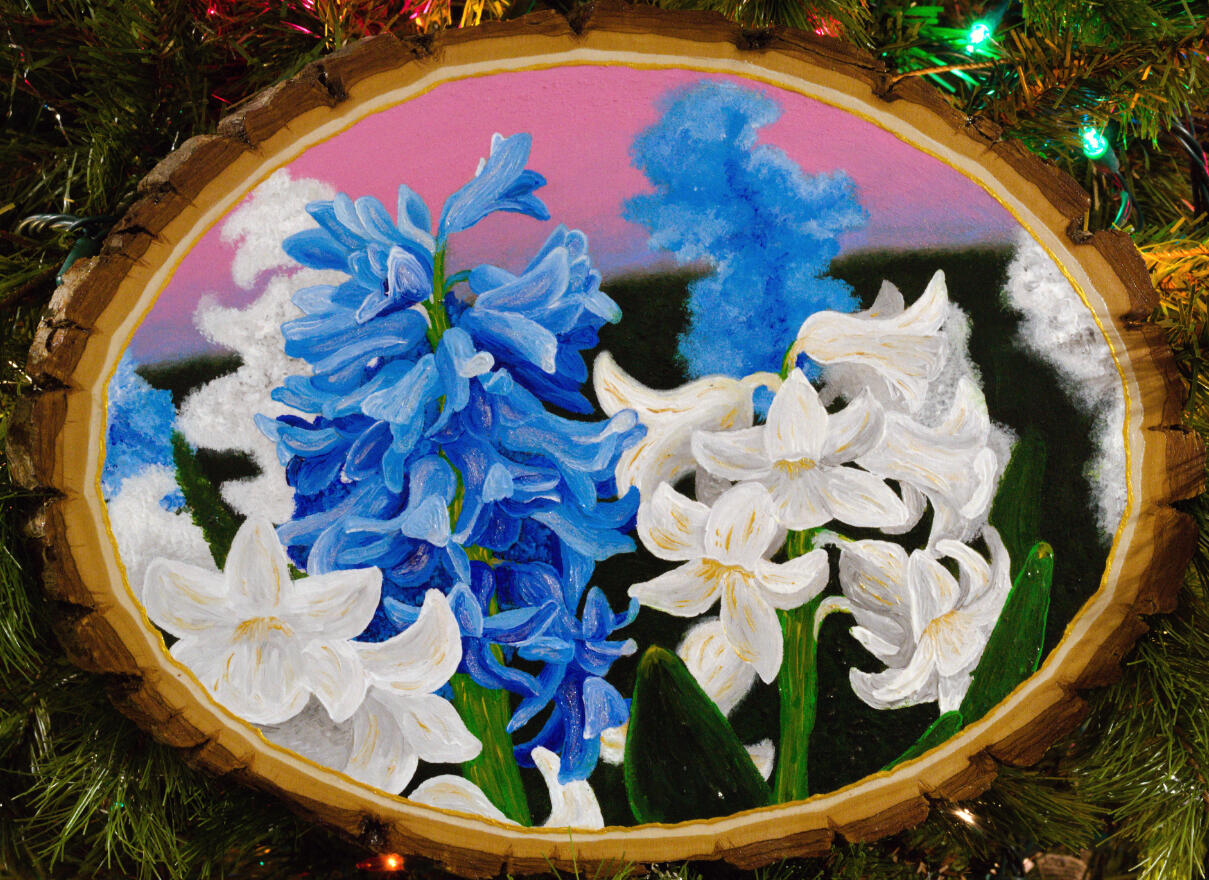 A painting of blue and white hyacinths against a pink sky.